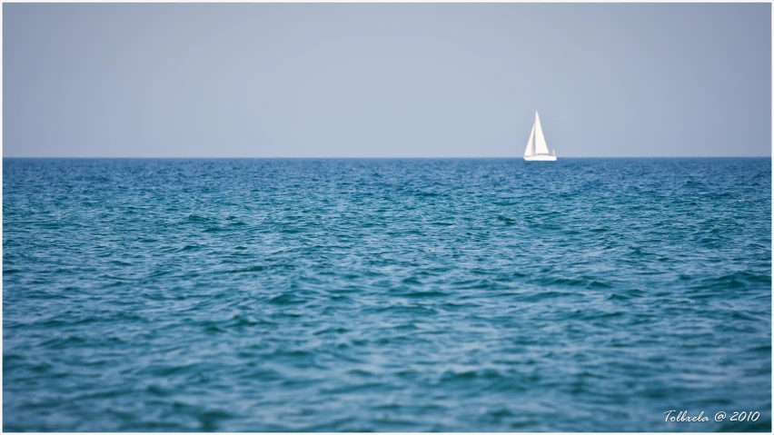 an image of a sailboat in the middle of the water