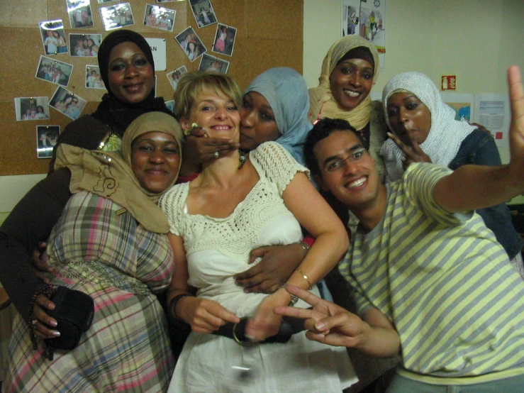 a group of women and men all posing together