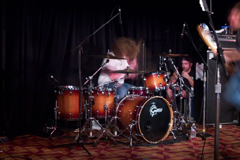 drummers perform on stage at an event