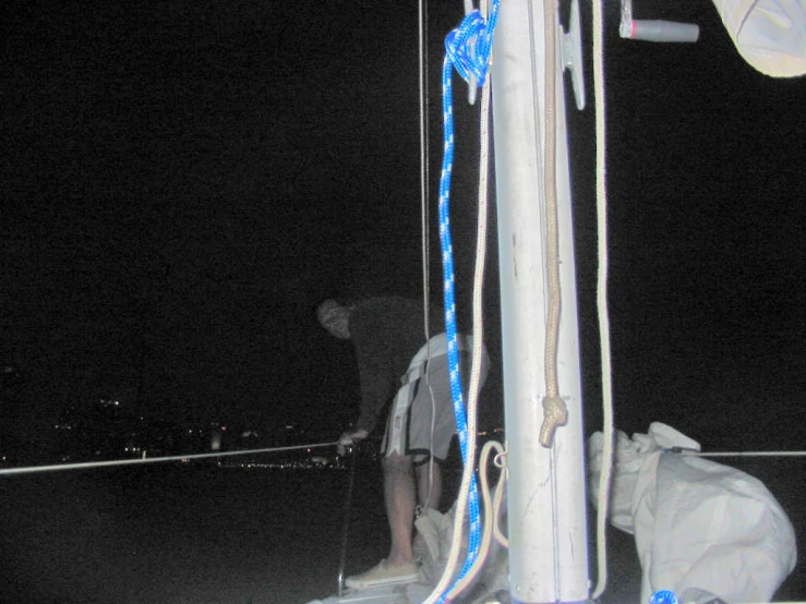 a person on the back of a boat at night