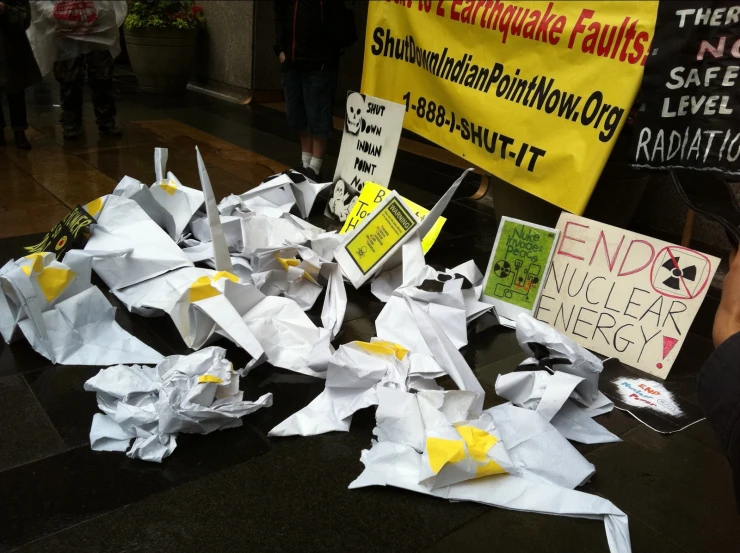 several pieces of paper and signs sitting on a table