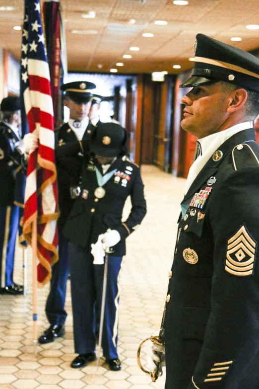 two military men, one in uniform, the other in dress clothes