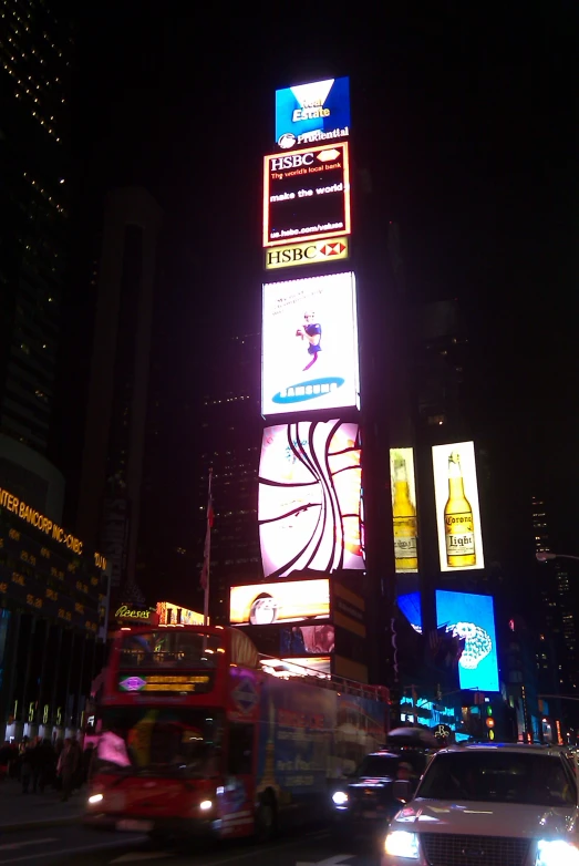 large illuminated billboards advertise various times of day