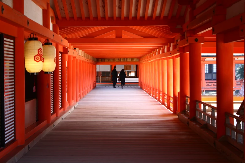 there is a red corridor leading to some doors