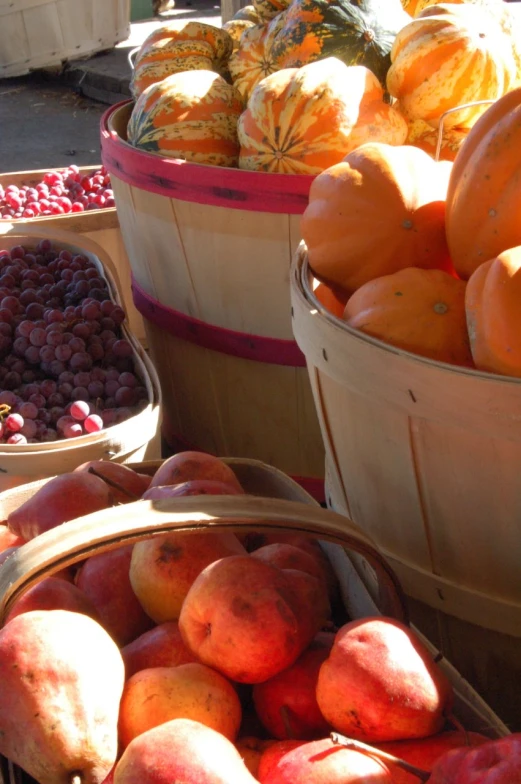 fruits are being sold at the market in baskets