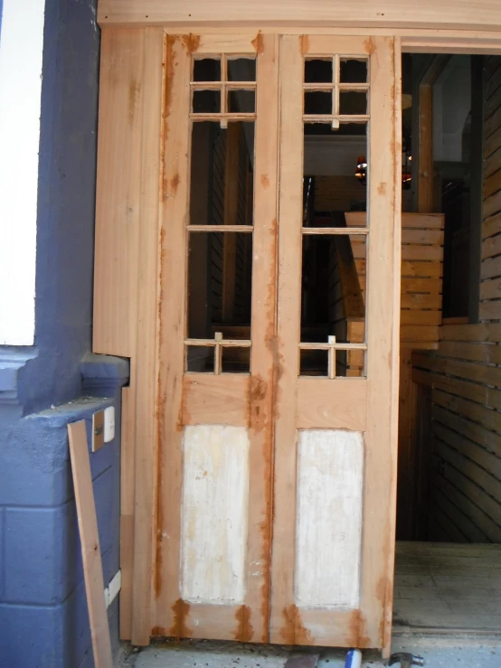 a large door in front of a doorway with windows