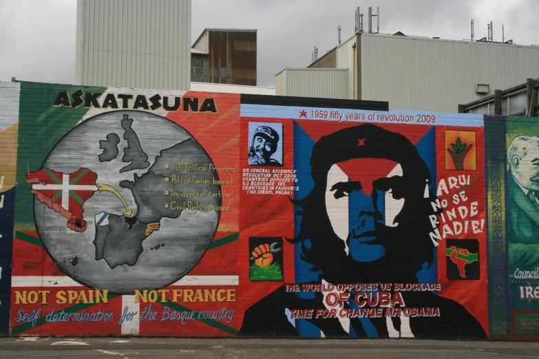 a wall of political posters in spanish and portuguese