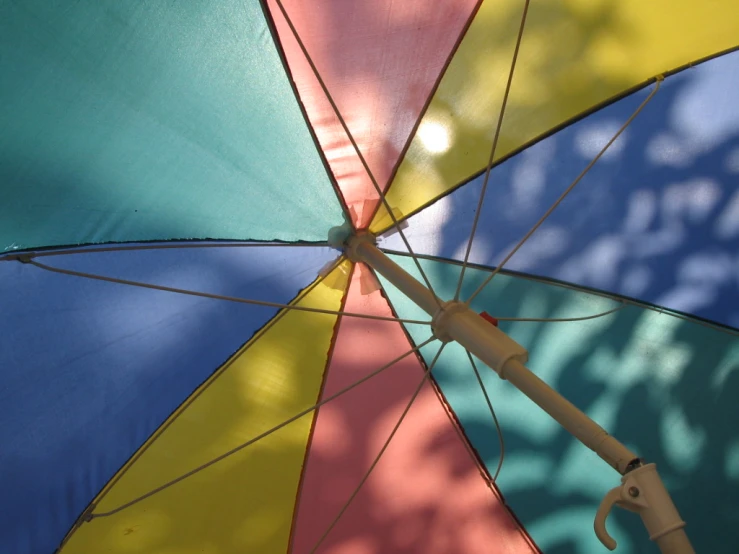 open umbrella in bright sun on sunny day