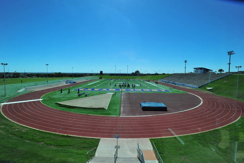 a stadium that is in a field near green grass