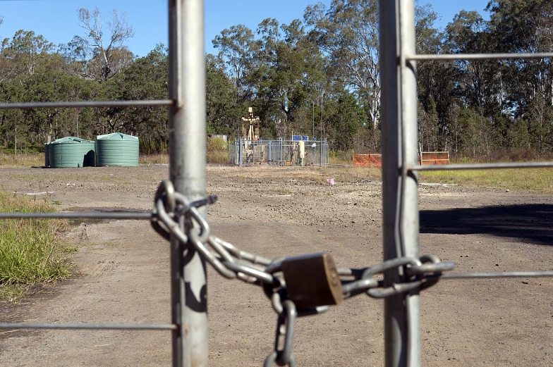 chain link gate and old rusty padlocks to open off and lock on