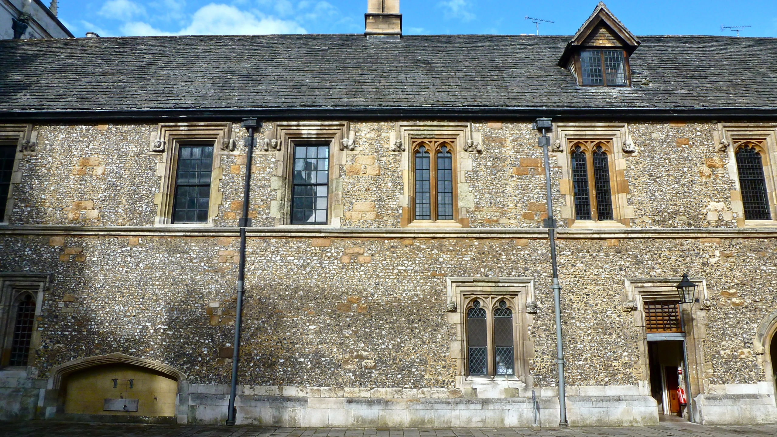 two men in front of an old building