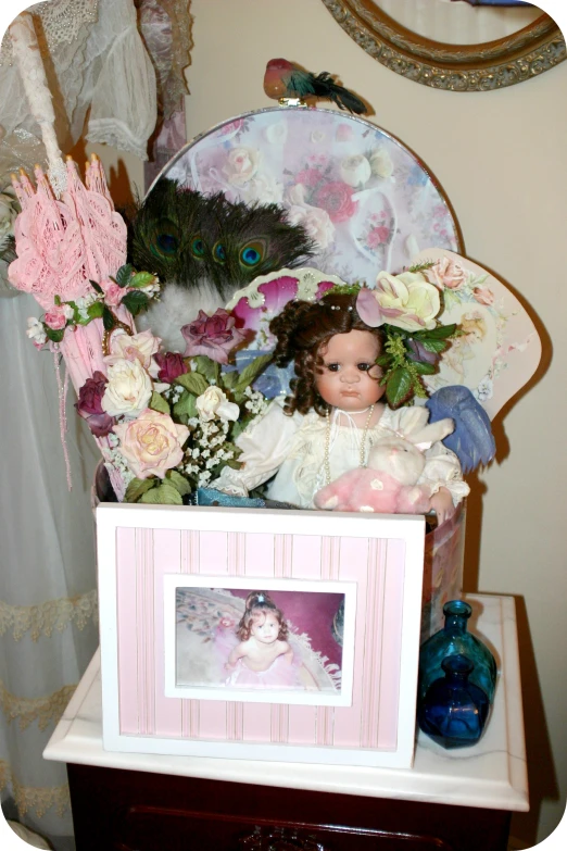 doll posed in a doll box on a table