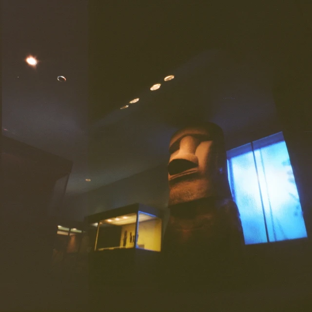 a very blurry image of a statue at night