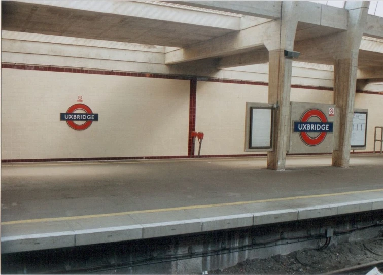 a train station with some empty platforms on the sides