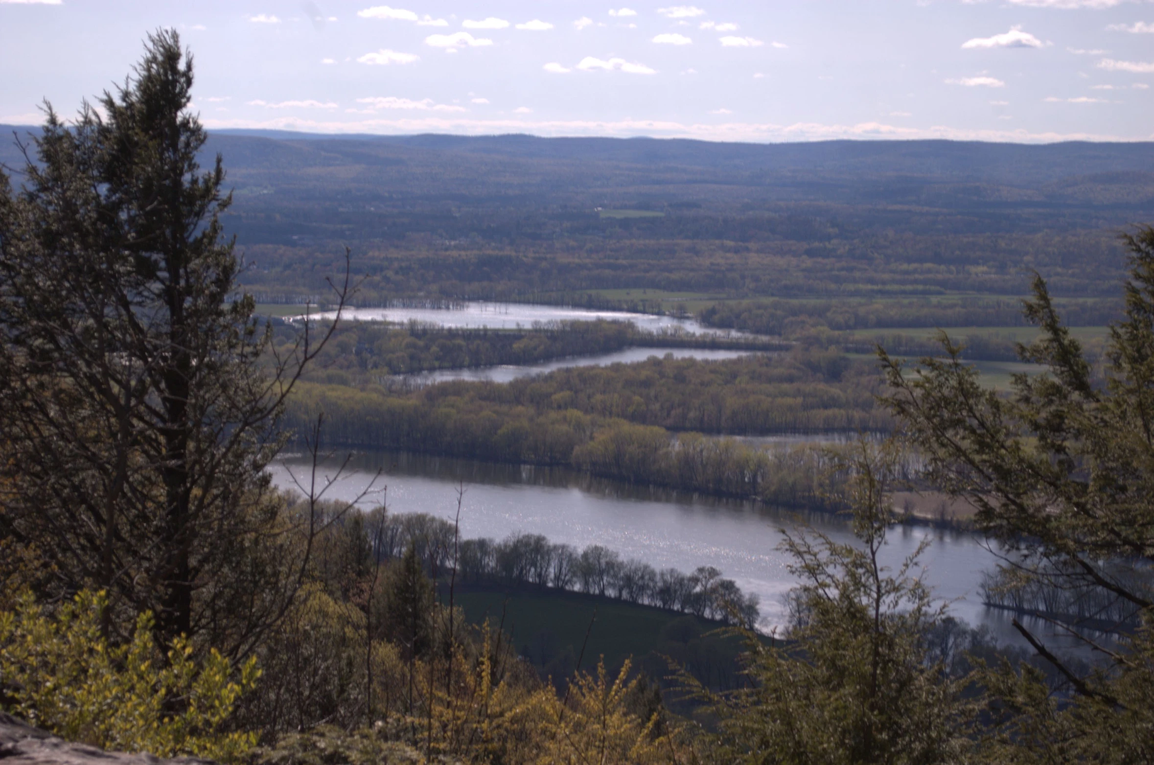 the view over the valley and river from the top of a mountain