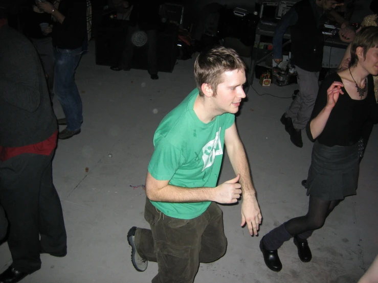 some young people dancing on a white floor