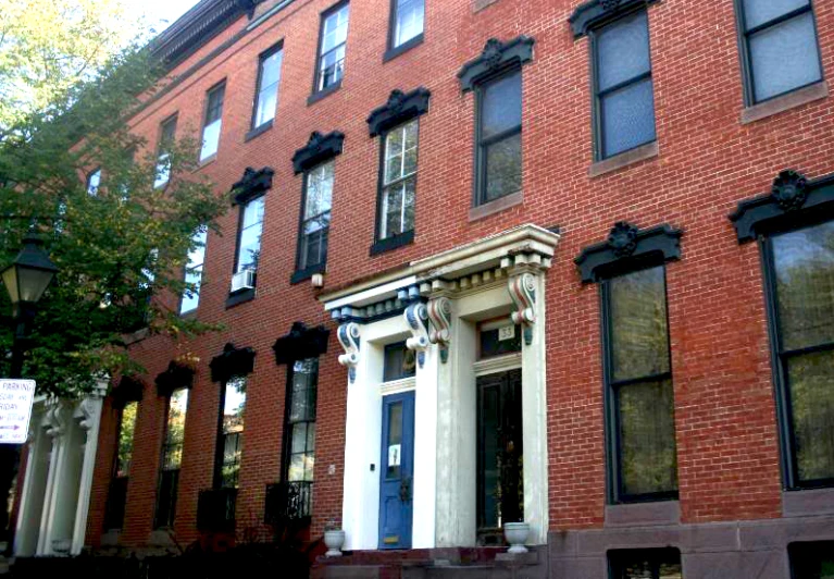 a large red brick building on a city street