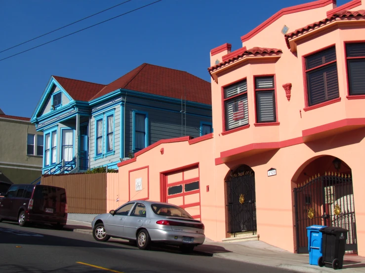 a car is parked on a street in a neighborhood