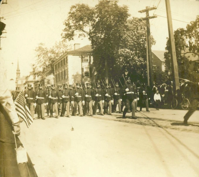 some people are marching on the street in a line