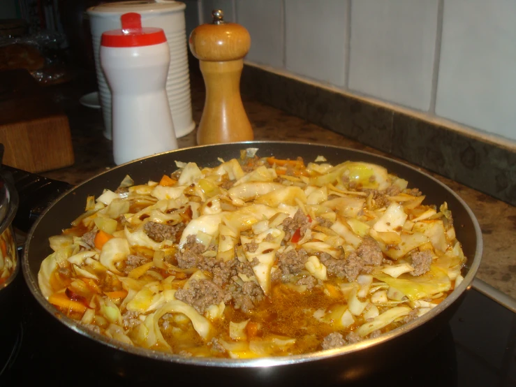 a pot with food cooking on a stove top