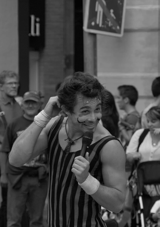 a man with his face painted in a clown mask