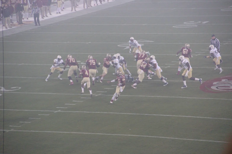 many football players on the field playing