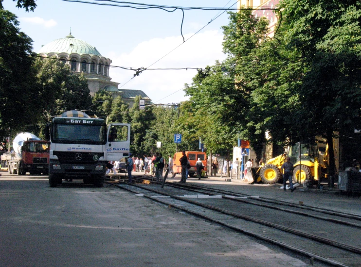 a large truck driving on a city street