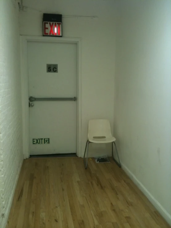 there is a white door on the side of a hallway