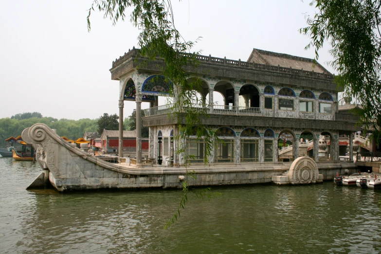 a large house that is on the side of a lake