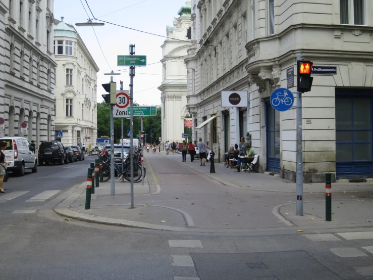 a city street lined with buildings and cars