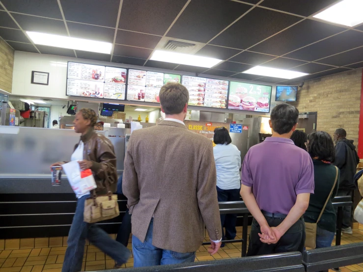 a group of people at a fast food restaurant