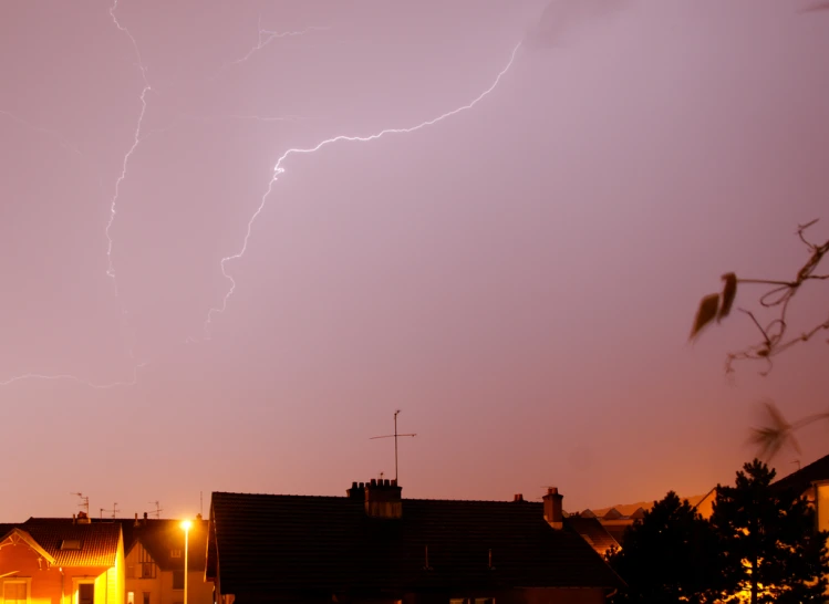 two lightning strikes and the house's chimneys glow orange