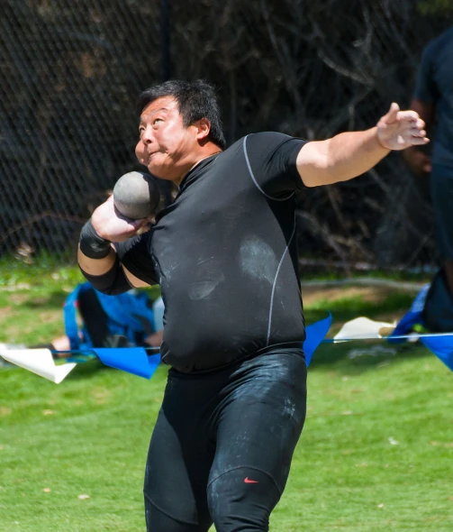 a man throwing a ball in an open field