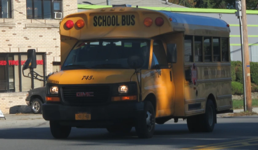 a school bus sits in the middle of the road