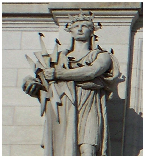 statue of a person holding a bunch of birds in their hands