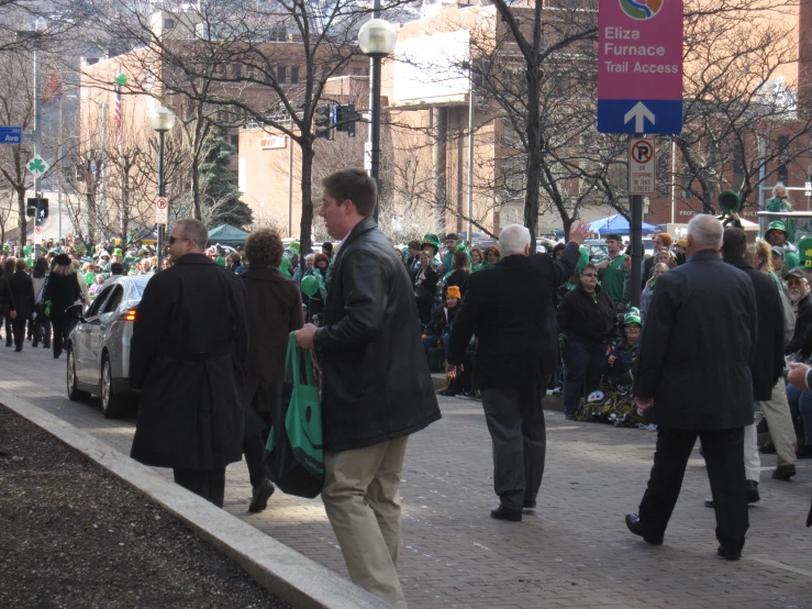 a group of people walking down a street