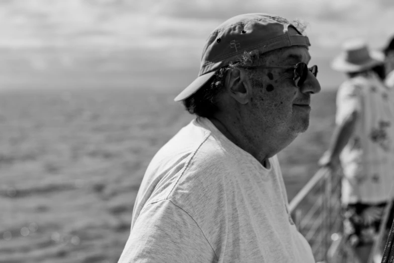 black and white po of a man fishing on the river