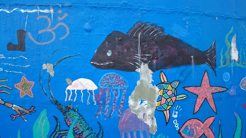 a mural of a sea animals on a blue wall