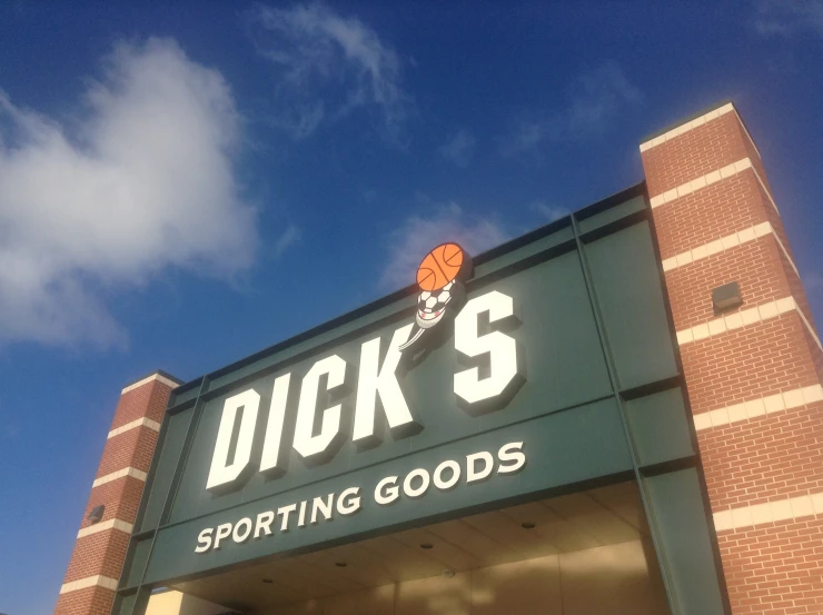 the storefront of duck's sporting goods with a blue sky background