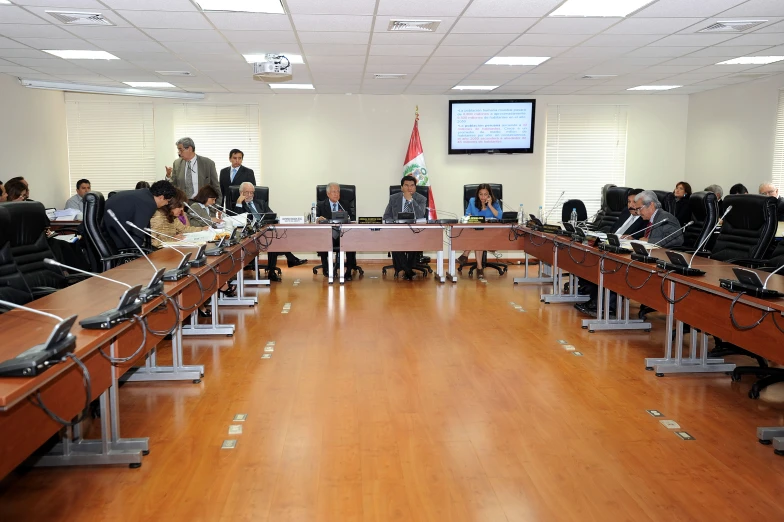 a conference room filled with men and women