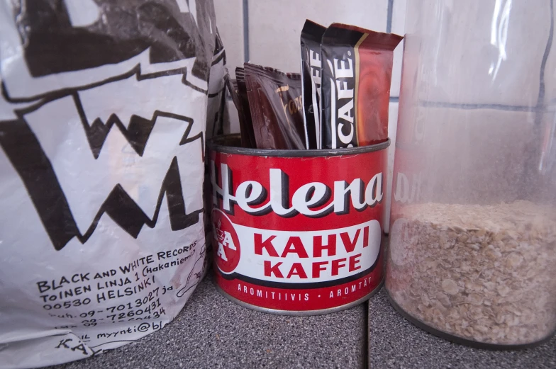 a close up of a bag and a container on the table