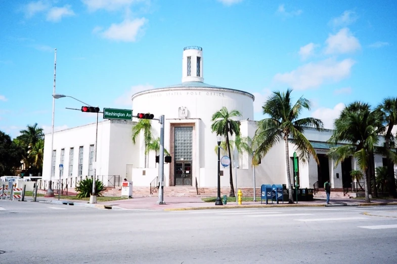 a building with a dome on the corner of a road