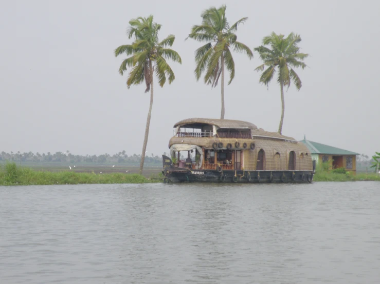 the house boat is cruising through the water