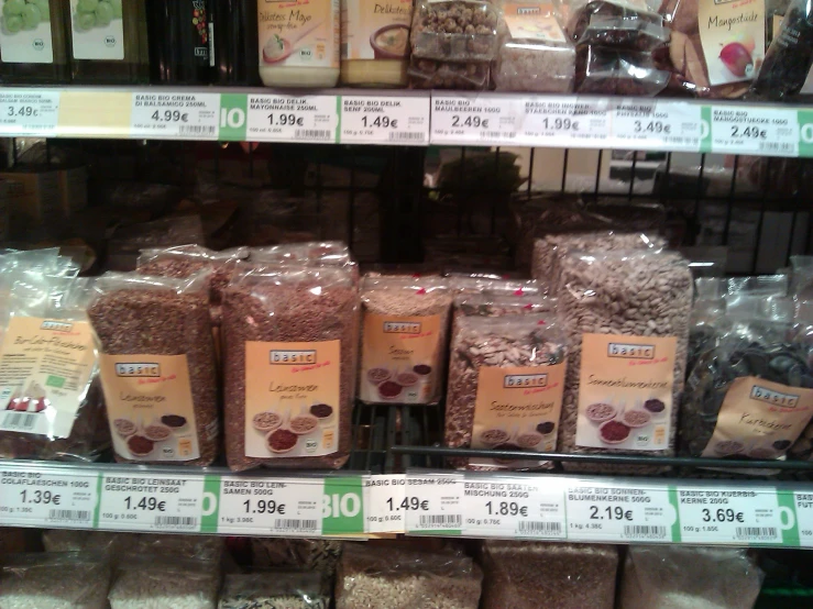 a store shelf filled with packages and bags of spices