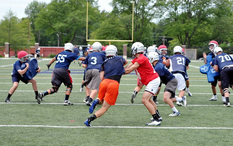 a group of s running a ball during a game