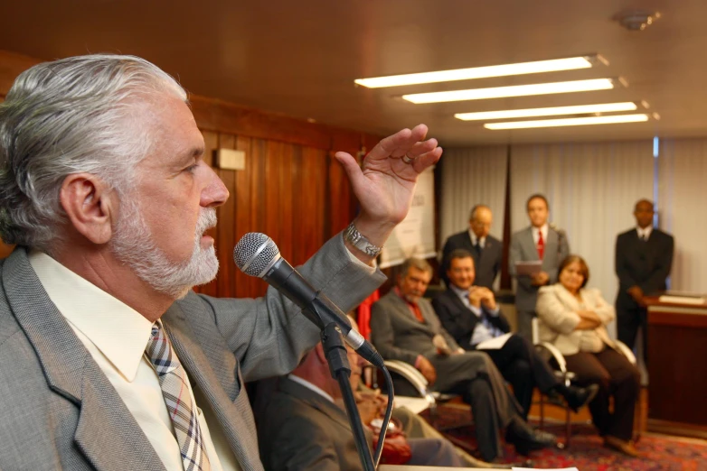 a man that is in front of a microphone