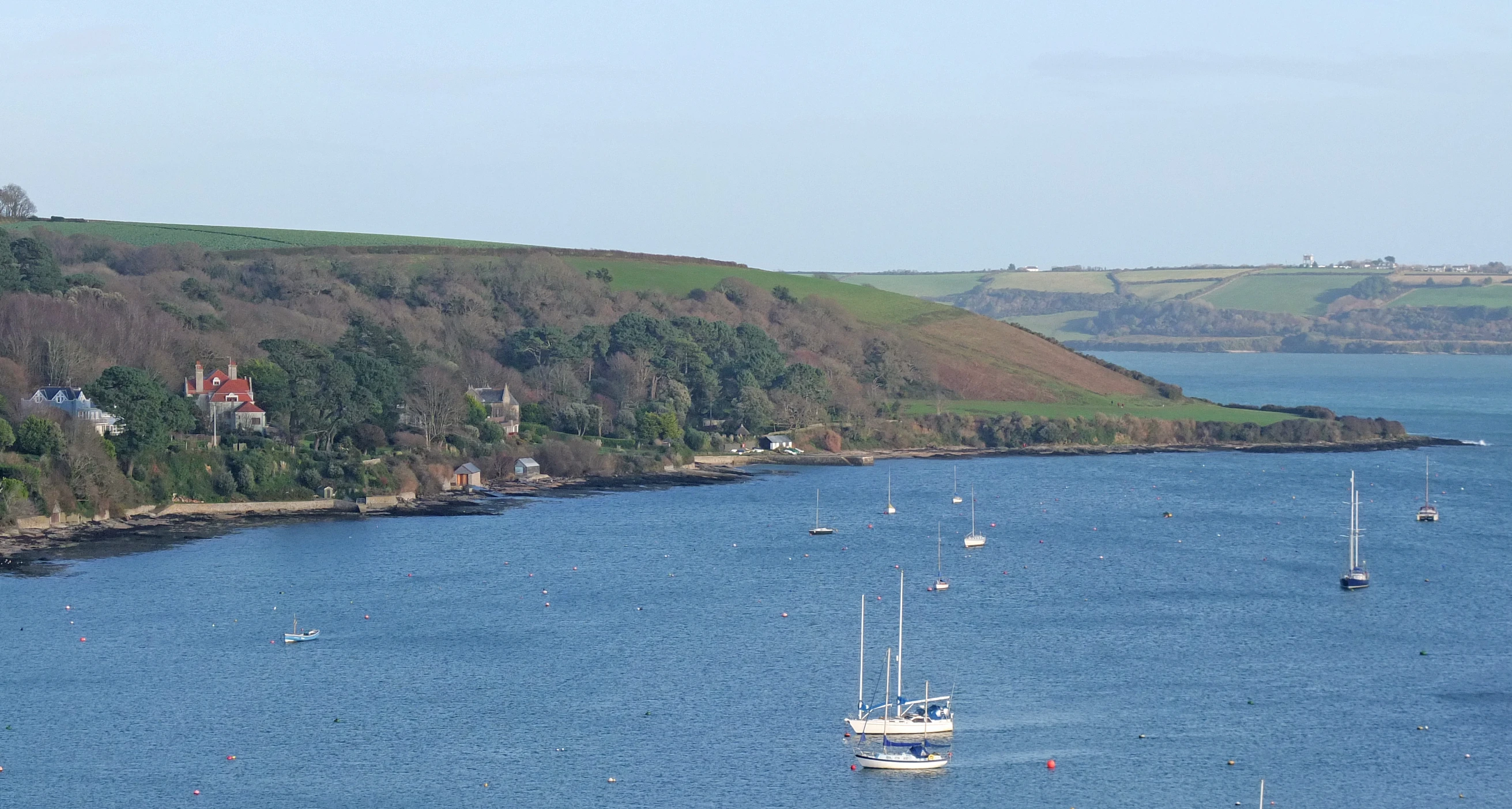 a large body of water with several boats in it