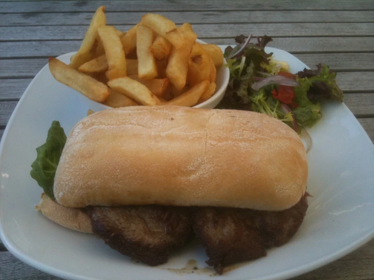 a sandwich and fries on a plate