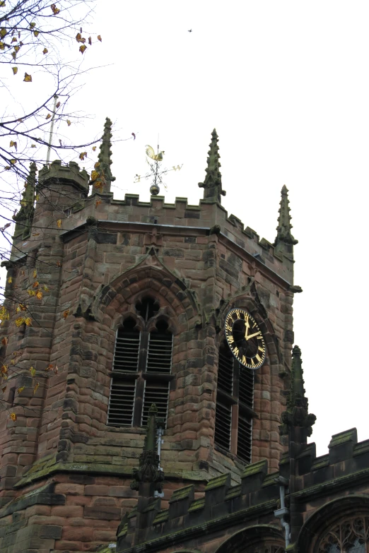 the clock is visible on a brick church