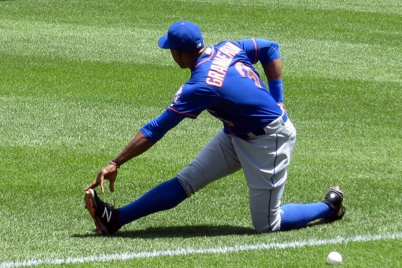 baseball player on the field playing with ball